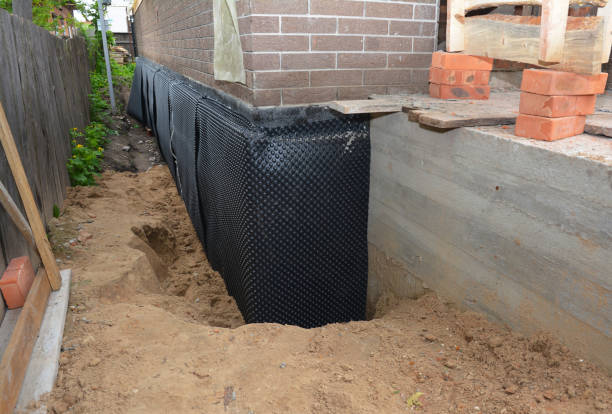 Happy homeowners after waterproofing job in Lutts